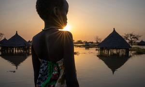 A girl looks out over submerged houses in Jonglei State in South Sudan. Flooding has devastated much of the area and it is estimated that more than 800,000 people in the country have been affected.