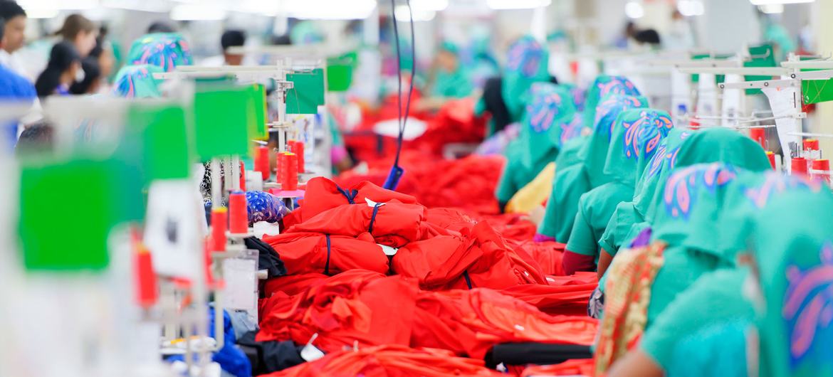 Garment employees work on a production line of an exporting clothing plant in Jordan. Garment employees work on a production line of an exporting clothing plant in Jordan.
