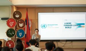 Aksonethip Somvorachit addresses young people at a youth event.