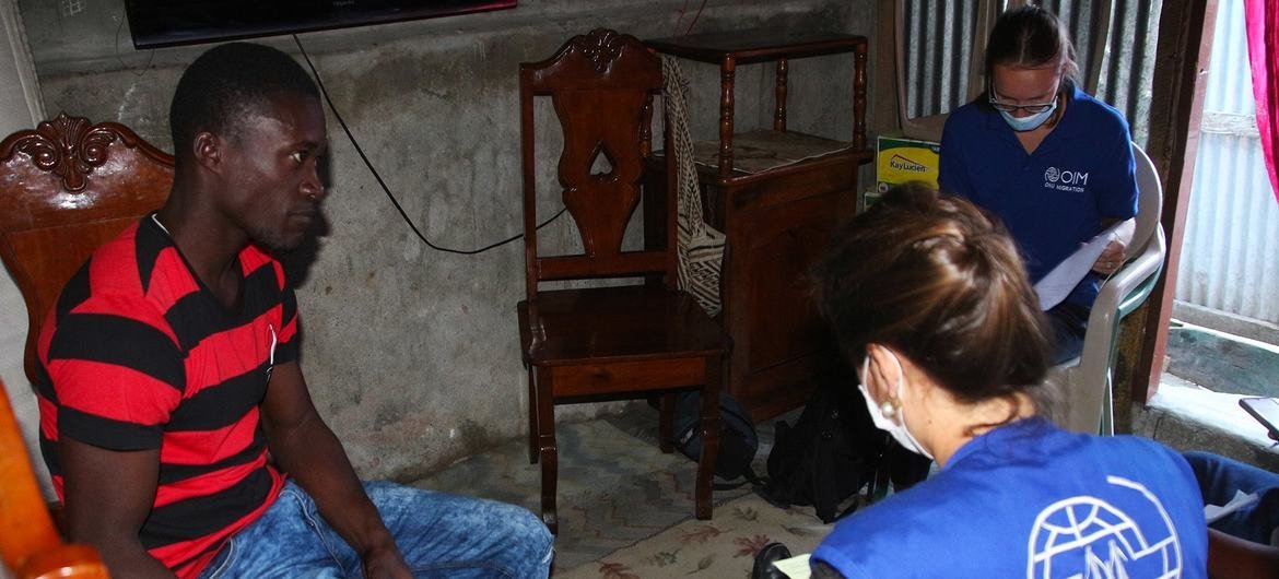 'Jacques' is interviewed by IOM staff after passing by boat.