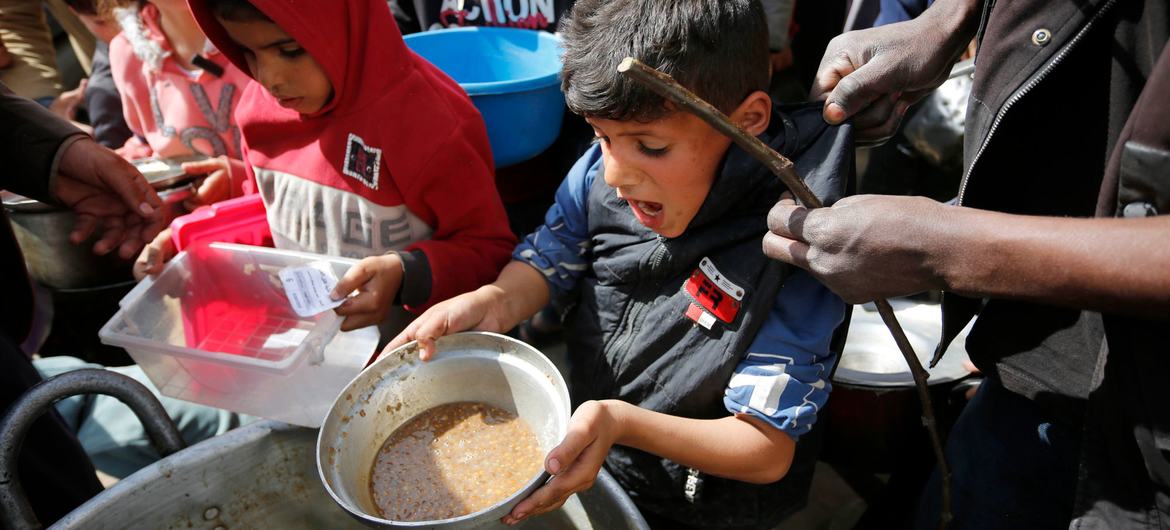 Children in the Gaza Strip receive food as supplies continue to dwindle.