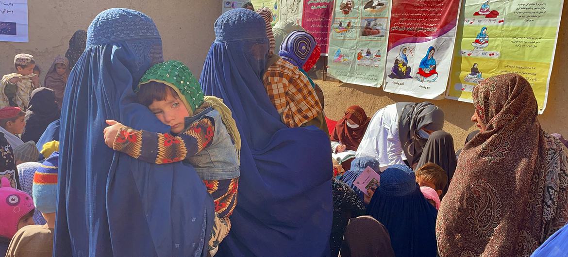 Women and children wait to be seen by members of a UNICEF-supported mobile health and nutrition team in Kandahar, Afghanistan.