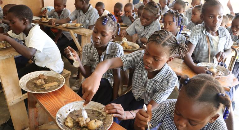 Students eat lunch at their school in Belle Onde village, in central Haiti.