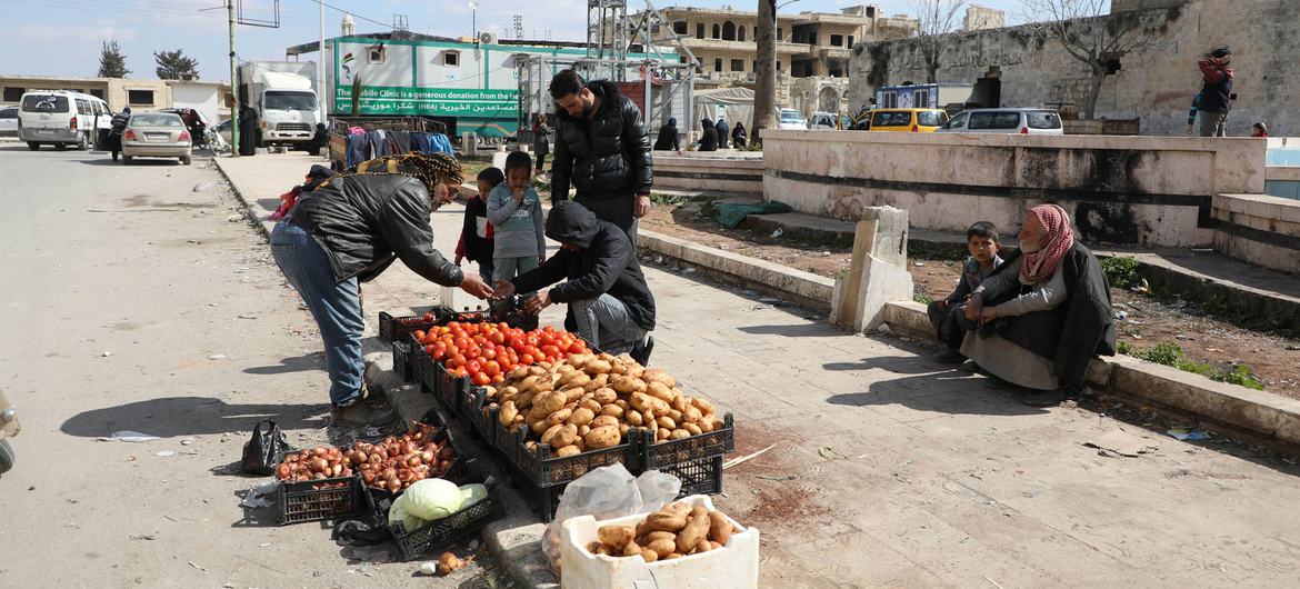 A man sells vegetables on the streets of Idleb in Syria.