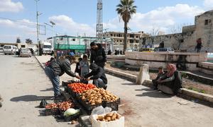 A man sells vegetables on the streets of Idleb in Syria.