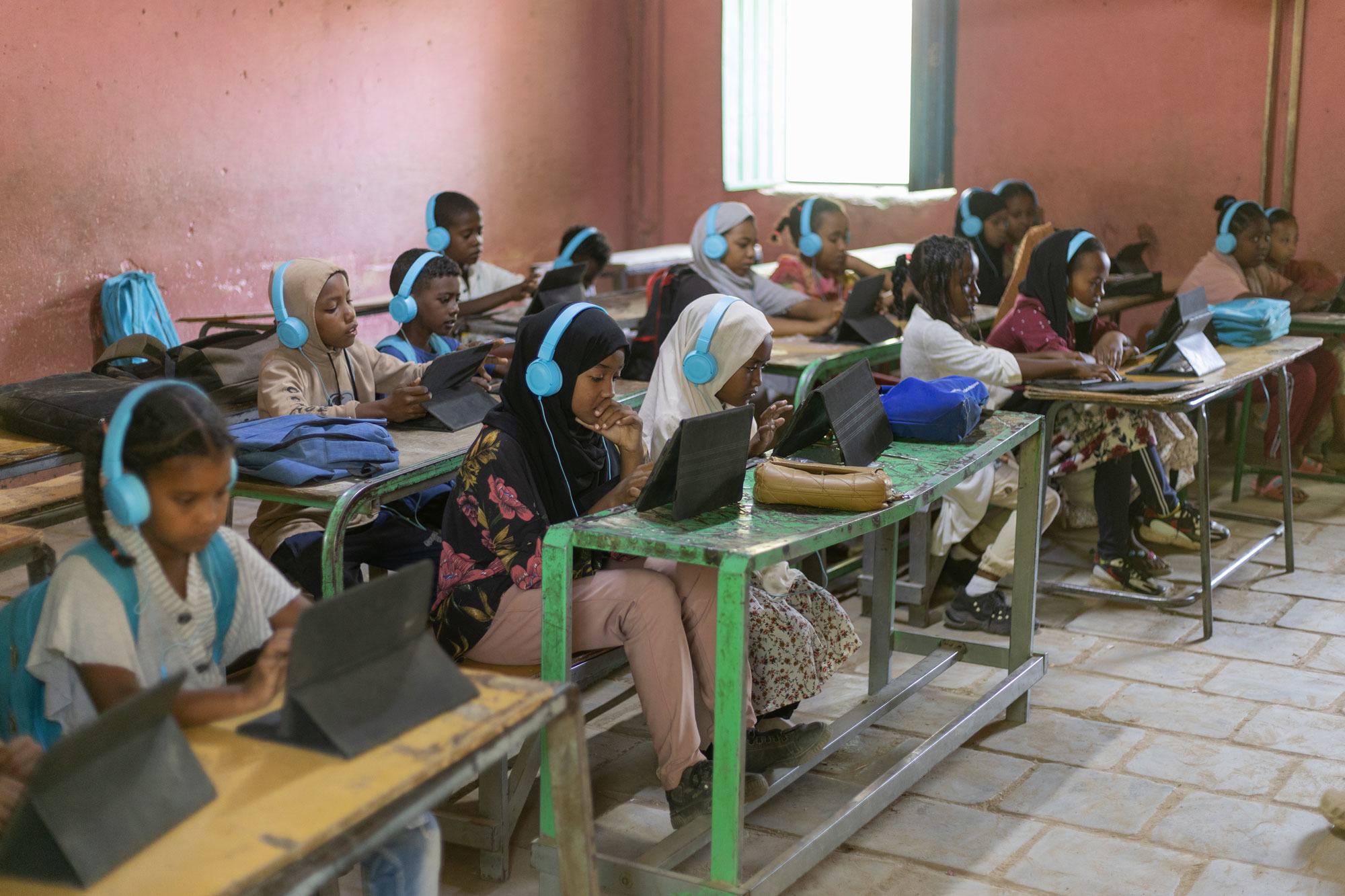 Children in Kassala, Sudan, study with the help of digital tablets. Children in Kassala, Sudan, study with the help of digital tablets.