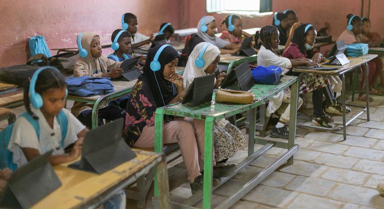Children are studying with digital tablets in Casala, Sudan.