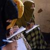 Women learn to read and write through a UN Women-supported literacy initiative in Nuristan province, eastern Afghanistan.