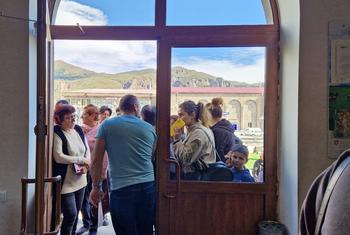 People who fled Karabakh wait to speak to local authorities in Goris, Armenia.