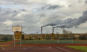 A school playground in the Belchatow neighbourhood of Kleszczow, Poland, near a coal-fired power plant. (file)