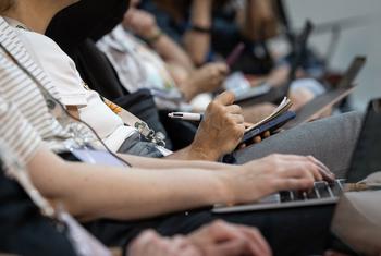 Journalists attend a press conference at the COP30 meeting in Belém, Brazil.