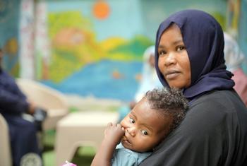 A woman receives support at a UNFPA Safe Space after fleeing Sudan.