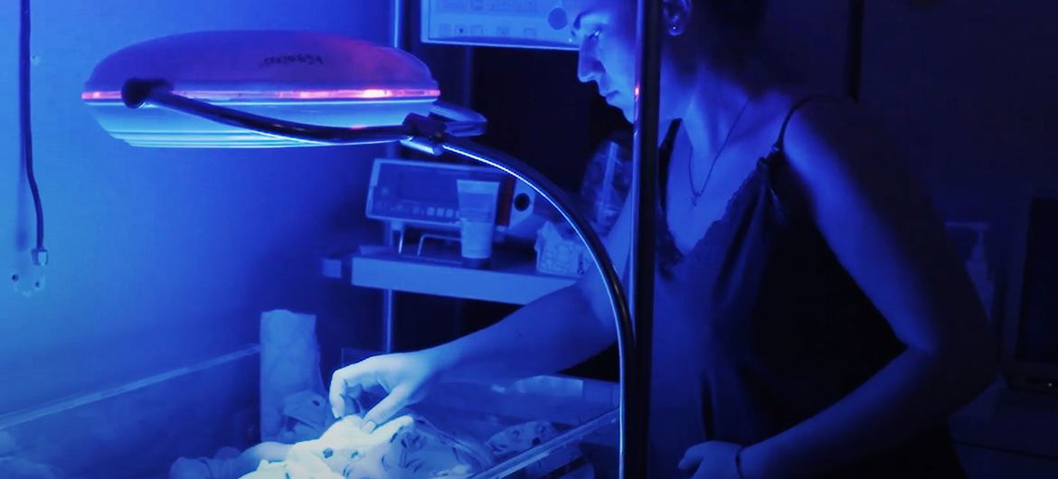 A mother watches over her newborn in an incubator at the Kherson City Perinatal Centre in Ukraine. (file) A mother watches over her newborn in an incubator at the Kherson City Perinatal Centre in Ukraine. (file)