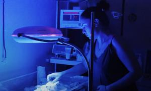 A mother watches over her newborn in an incubator at the Kherson City Perinatal Centre in Ukraine. (file)