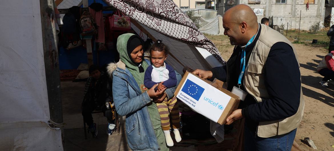 Warm clothing is distributed to displaced people in Rafah, in the southern Gaza Strip.