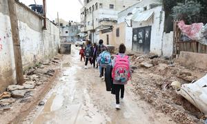 Children walk through partially destroyed streets in Jenin in the West Bank.