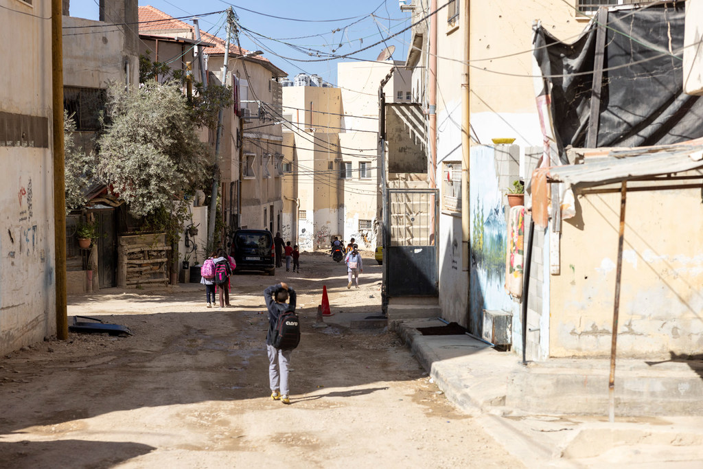 Children walk through Jenin refugee camp in the West Bank.