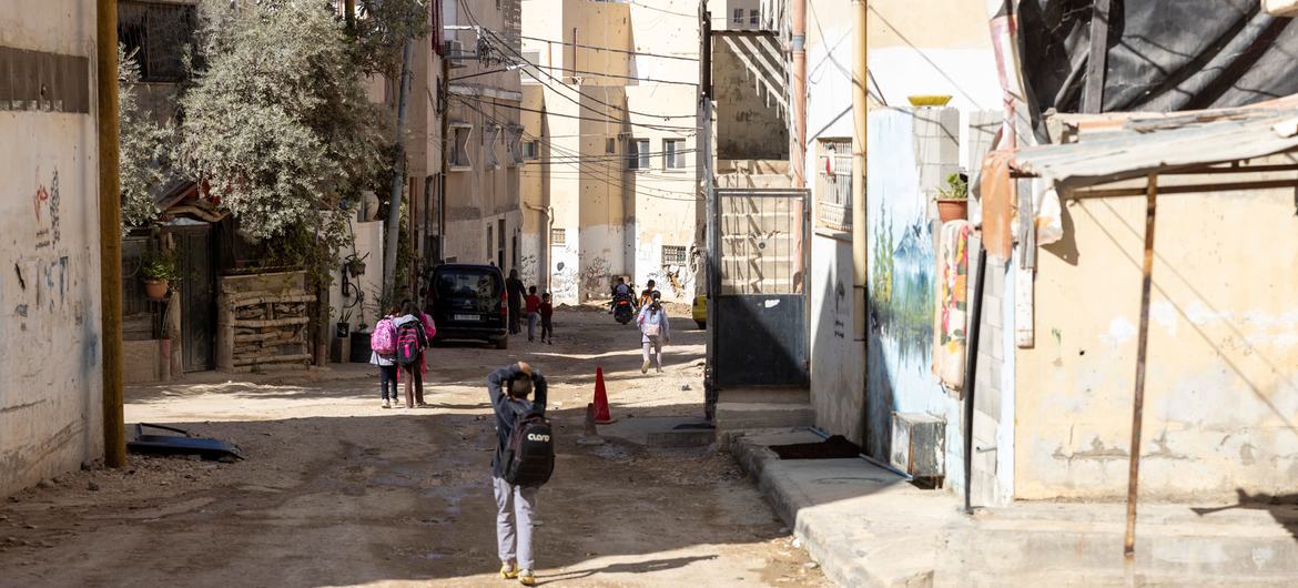 Children in Jenin refugee camp looking at the destroyed shelters following recent militarized operations. Photo Copyright Ahed Zhaiman.
