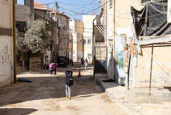 Children in Jenin refugee camp looking at the destroyed shelters following recent militarized operations. Photo Copyright Ahed Zhaiman.