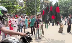 People gather in a street in Dhaka, the capital of Bangladesh.