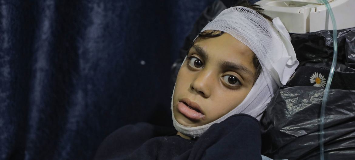 A boy recovers after being caught in an attack in Al Zaytoon neighbourhood of the Gaza City.