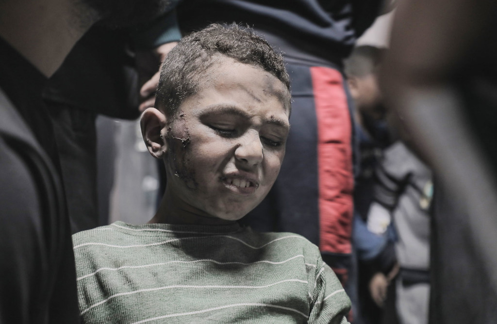 A young boy is rescued after he was caught in an attack on a school shelter.