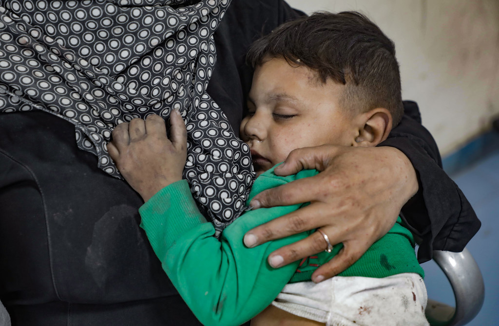 A young boy in Gaza waits to be seen in a hospital in Gaza after being caught in an attack. (file)