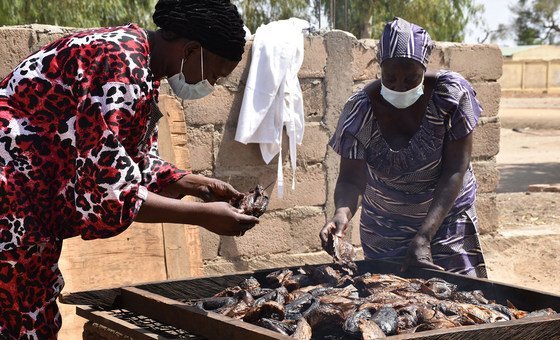 Displaced radical   person  been trained to process   the food  for sale.