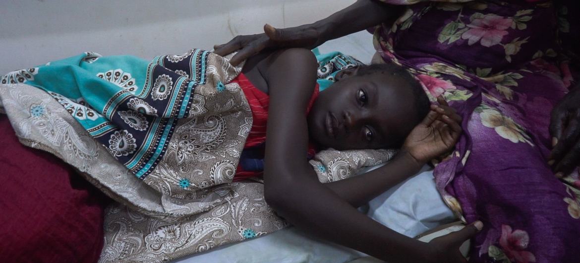 A young girl receives treatment at a hospital in Khartoum, Sudan.