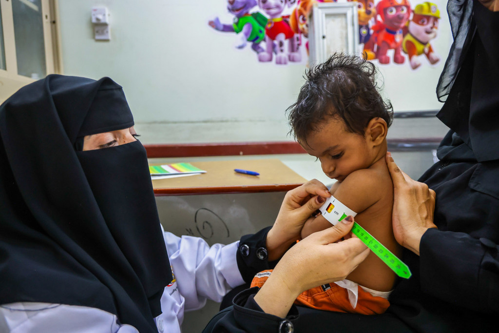 A young child is tested for malnutrition at a clinic in Yemen.