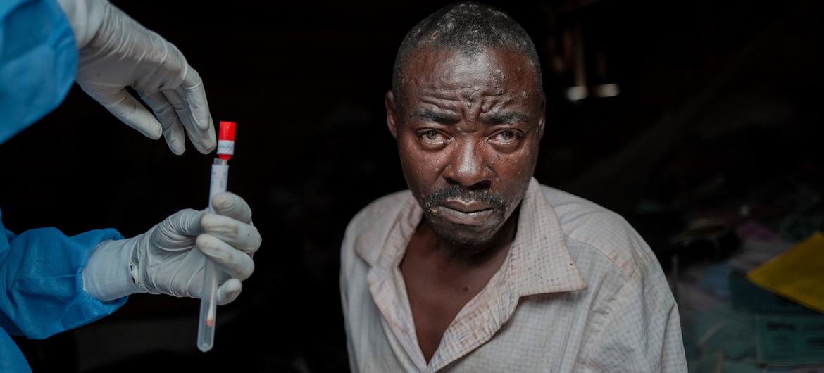 A man in eastern Democratic Republic of Congo undergoes a blood draw as part of treatment for mumps.