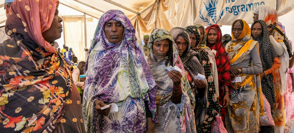 South Sudan. Sudanese refugees waiting to receive cash assistance from WFP.