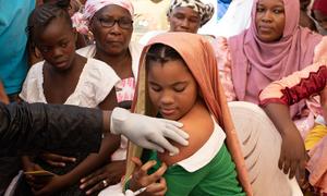 A young woman in Bamako, Mali, receives a vaccination for HPV, the main cause of cervical cancer.