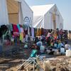 Les familles déplacées de Kordofan lavent leurs vêtements dans un centre d'accueil soutenu par l'UNICEF dans l'État de Gedaref, au Soudan, au milieu du conflit en cours.