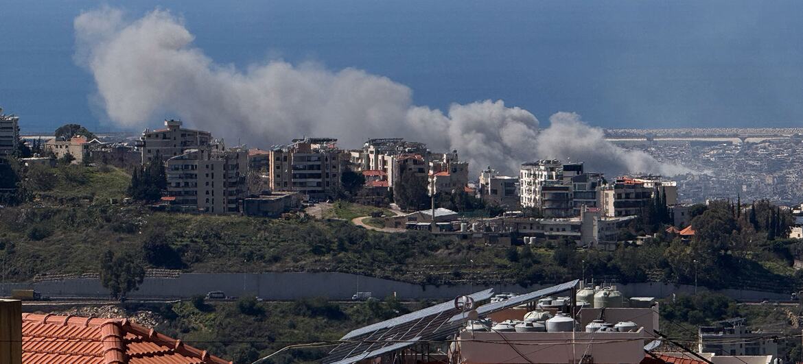 Smoke rising from air strikes over the city of Beit Mery, Lebanon, with the Mediterranean Sea in the background.
