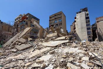 Destroyed residential buildings in the Basta neighborhood of Beirut, Lebanon, showing widespread rubble and debris following Israeli airstrikes.
