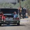Children travel in the trunk of a car as they leave Rafah in southern Gaza.