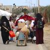 Une famille palestinienne fuyant Rafah, dans le sud de la bande de Gaza.