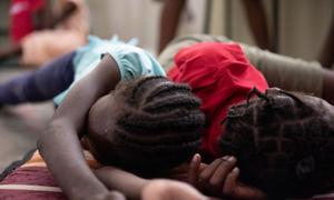 Children sleep in a school in Port-au-Prince, Haiti, where their families have taken refuge from gang violence.