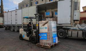 Lifesaving supplies for children and families are unloaded at a UNICEF warehouse in Gaza.