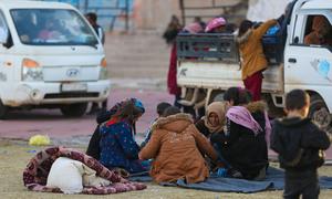 A family gathers at a reception centre in Ar-Raqqa city, Syria.