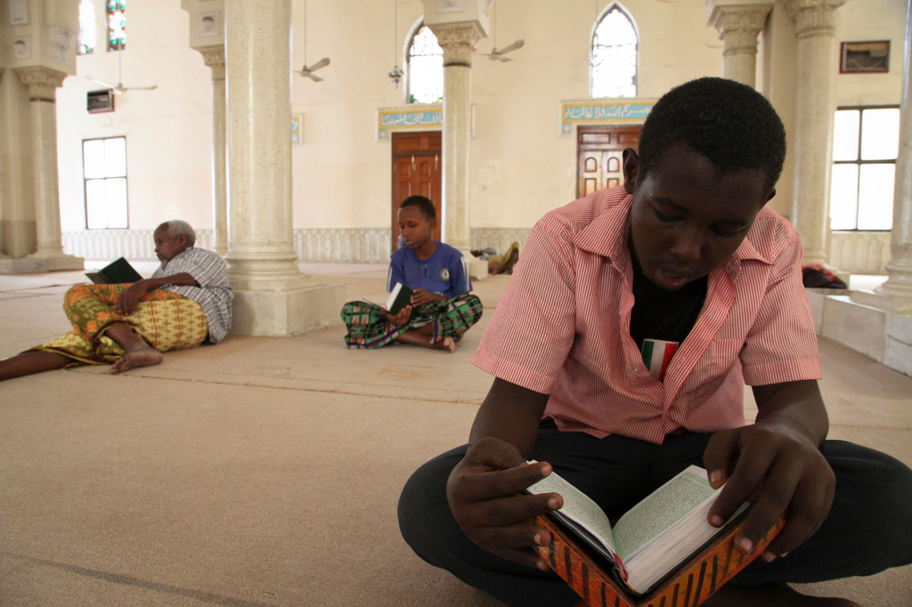 A boy reads from a Koran at a mosque in Mogadishu, Somalia.