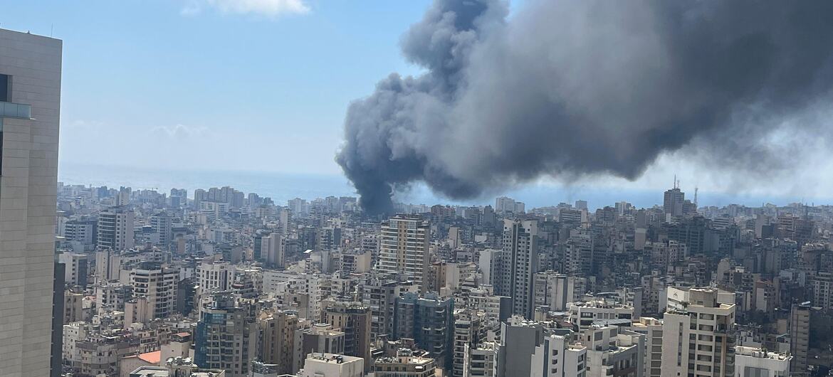 Smoke rises from a bombing in Beirut, Lebanon, seen from a high vantage point overlooking the city's dense urban landscape on April 8, 2026.