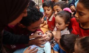 A baby receives the polio vaccine during an immunization campaign in Gaza in October 2024. (file)