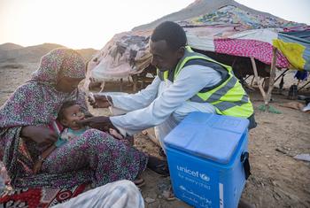 A baby is vaccinated against polio in a remote region of Red Sea state in Sudan.