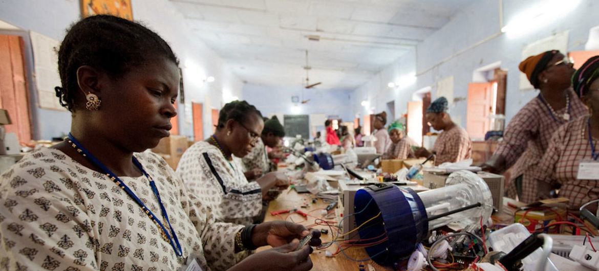 Women from rural areas learn how to build solar power items.