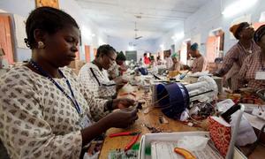 Women from rural areas learn how to build solar power items.