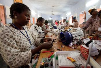 Women from rural areas learn how to build solar power items.