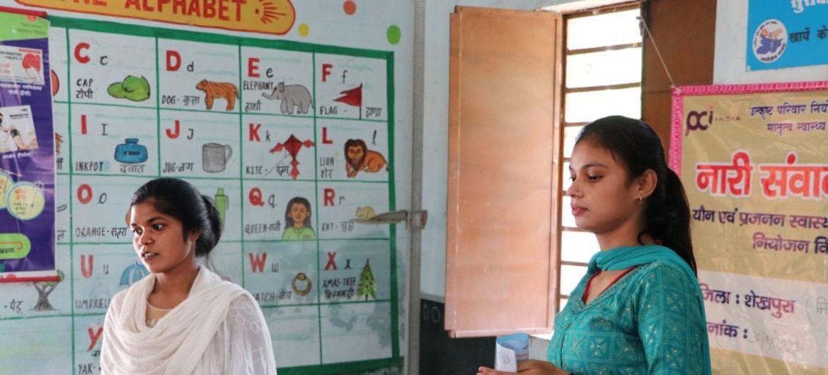 Two community workers provide information about contraceptives in Bihar, India.