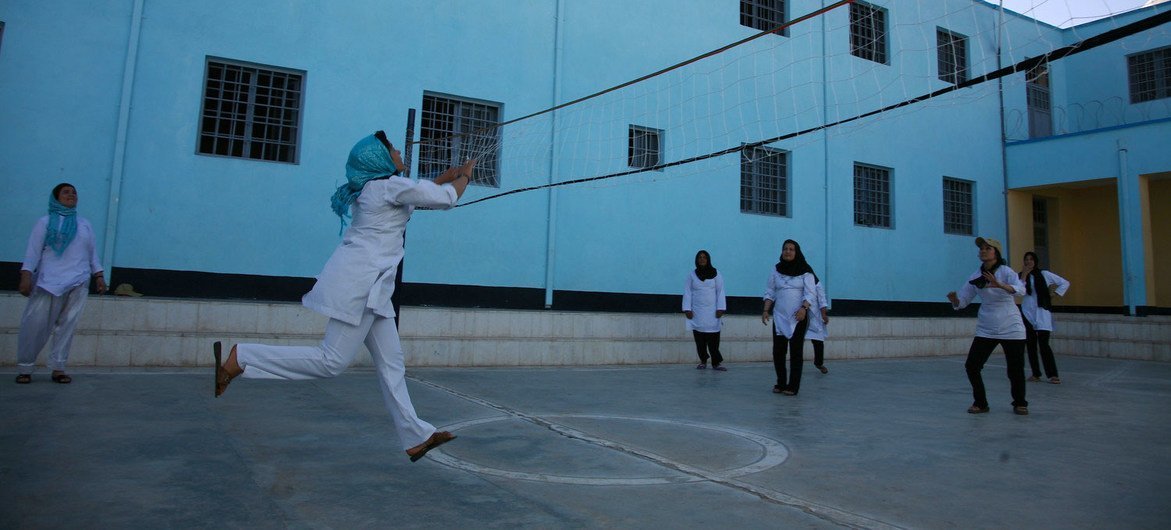 Girls play volleyball at a school in Herat, Afghanistan, 2016.